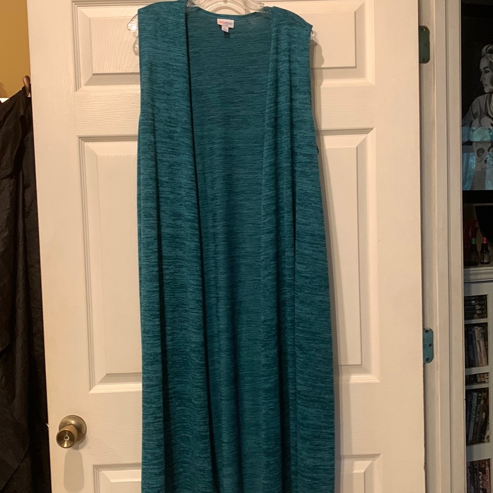 LuLaRoe. Joy.  Long vest. Like New. Never worn. Teal blue. Some white & black